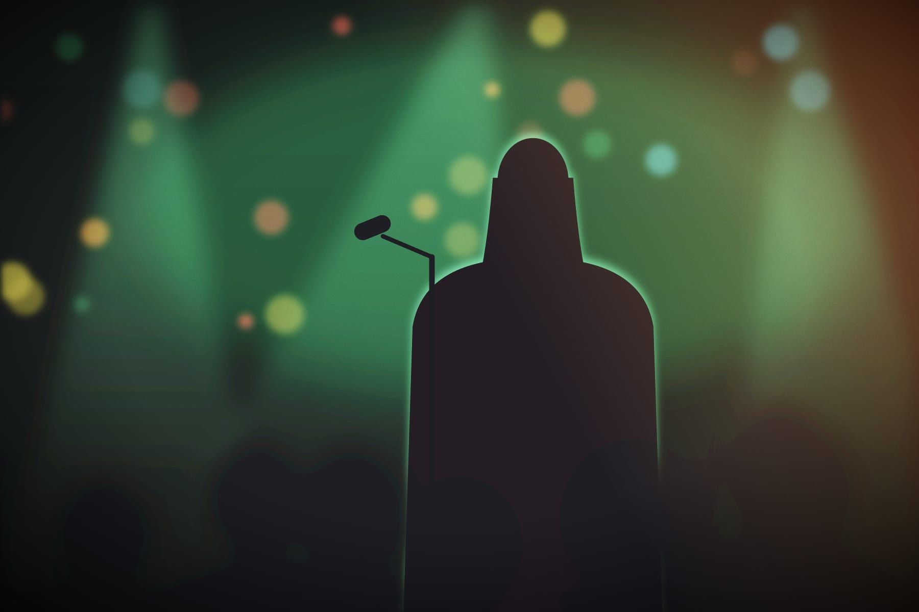 A performer at the mic under green light