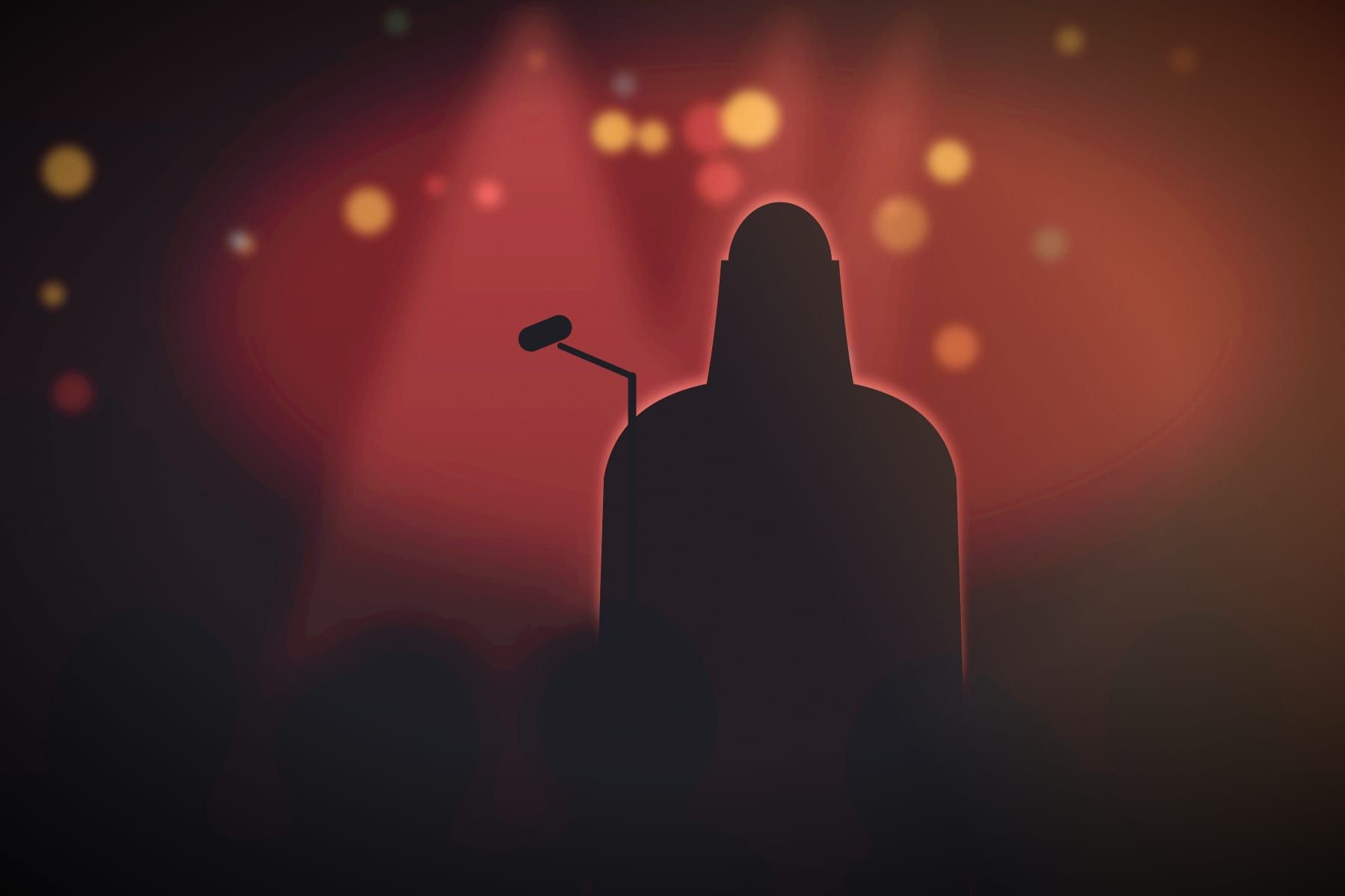 A performer at the microphone under red light